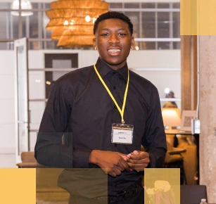 Smiling male African American high school student in a school setting