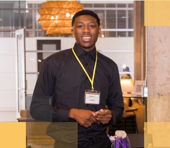 Smiling male African American high school student in a school setting